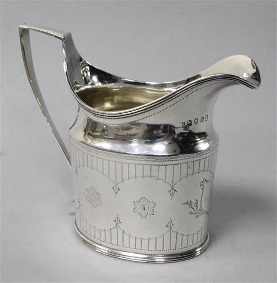 A George III engraved silver cream jug, probably by Soloman Hougham, London, 1803, 4 oz.